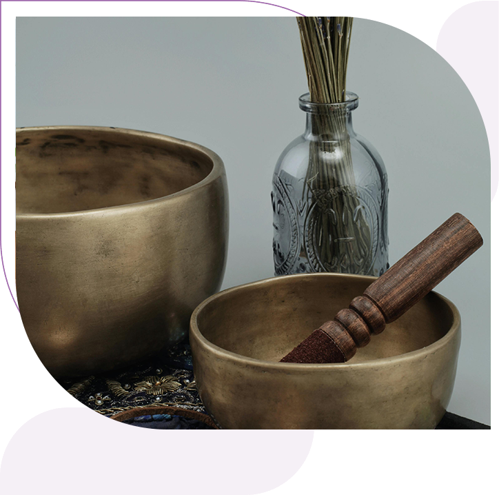 A close up of two bowls and a wooden stick