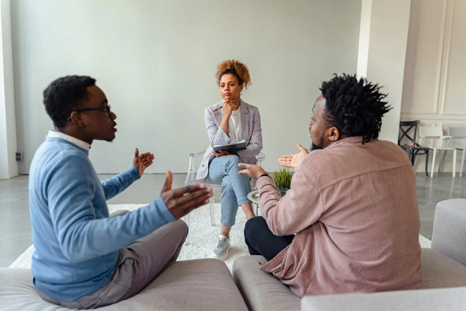 A group of people sitting on top of a couch.