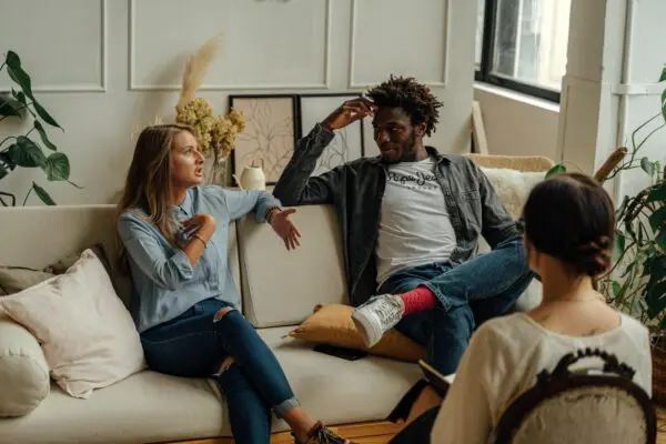 A group of people sitting on top of a couch.