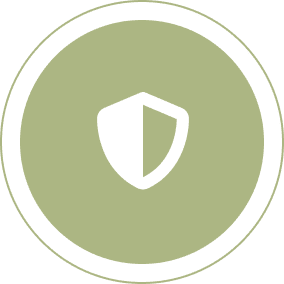 A green circle with a white shield icon in the center.